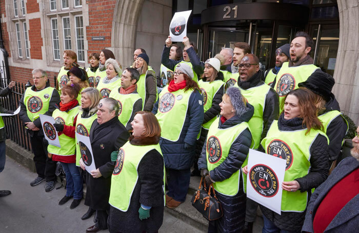 English National Opera chorus members singing outside the offices of Arts Council England. Photo: Marcus Clarkson