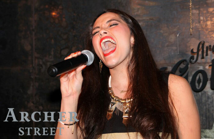 A contestant takes part in Archer Street's Got Talent