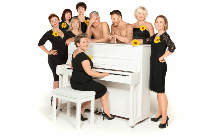 The Girls cast and creators, clockwise from left: Sophie-Louise Dann, Debbie Chazen, Michele Dotrice, Marian McLoughlin, Claire Machin (seated), Tim Firth, Gary Barlow, Claire Moore and Joanna Riding