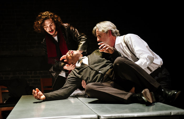 Billy Postlethwaite, Burt Caesar and Martin Turner in The Plague at the Arcola Theatre, London. Photo: Alex Brenner