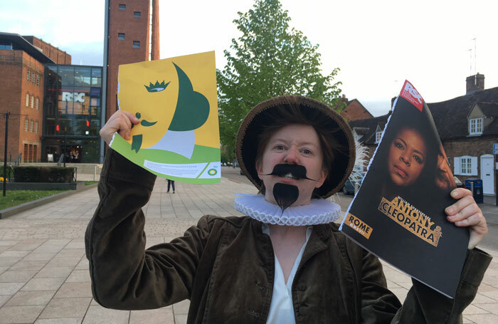 Protester Phoebe Demeger outside the Royal Shakespeare Theatre. Photo: Rikkiindymedia