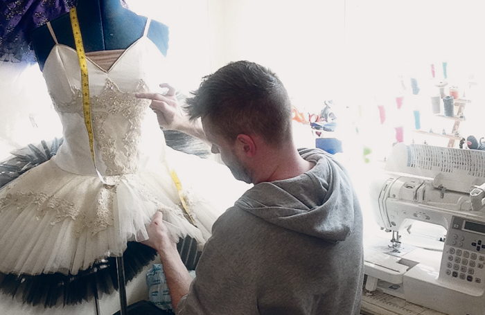 Designer and technician Mike Lees preparing a costume for a fitting. Photo: Mike Lees