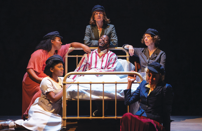 Clockwise around the bed from left: Aretha Ayeh, Sophia Nomvete, Clare Burt, Amanda Hadingue and Sandy Foster all as Joan Littlewood, and centre Solomon Israel as Gerry Raffles. Photo: Topher McGrillis