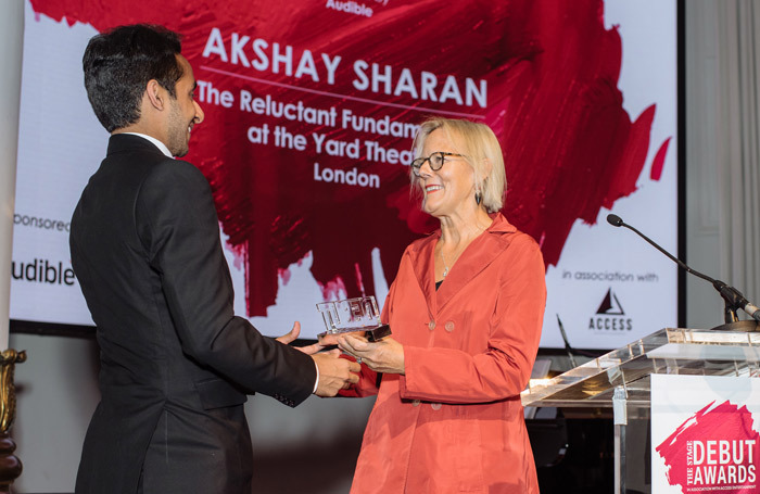 Director Phyllida Lloyd (right) presents Akshay Sharan with The Stage Debut Award for best actor in a play. Photo: David Monteith-Hodge