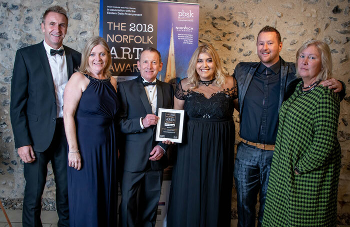 Members of Norwich's GoGoHares visual art community project with their Norfolk Arts Award. Photo: Simon Finlay