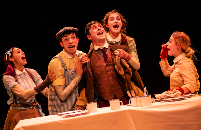 Craig Fairbairn as Bob Cratchit with ensemble from Newcastle College.  Photo: Pamela Raith