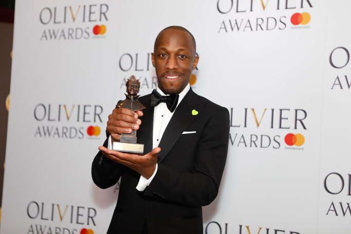 Giles Terera picking up his Olivier award for best actor in a musical. Photo: Pamela Raith