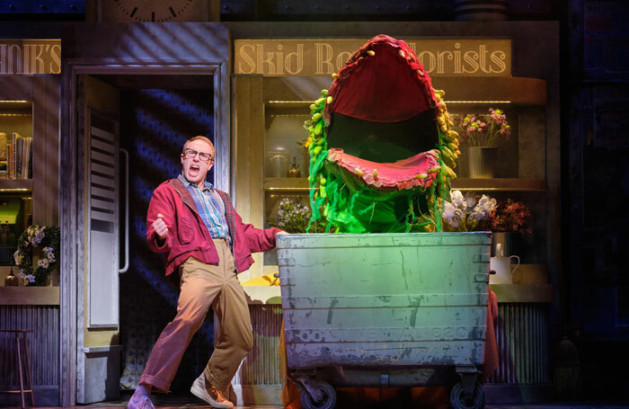 Joshua Lay and Audrey II in Little of Horrors at Storyhouse, Chester