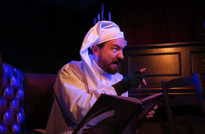 Dominic Allen in A Christmas Carol: The Immersive Dining Experience. Photo: Steve Stevens