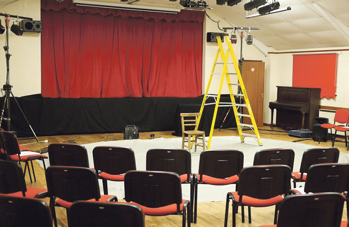 Setting up for a performance at Drimpton Village Hall in Somerset