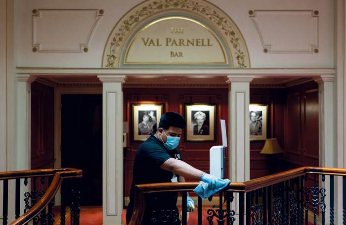 A member of staff cleaning the London Palladium at a Covid-19 test event. Photo: Andy Paradise
