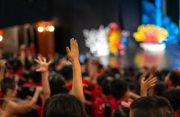 Audiences attend a pantomime. Photo: Shutterstock