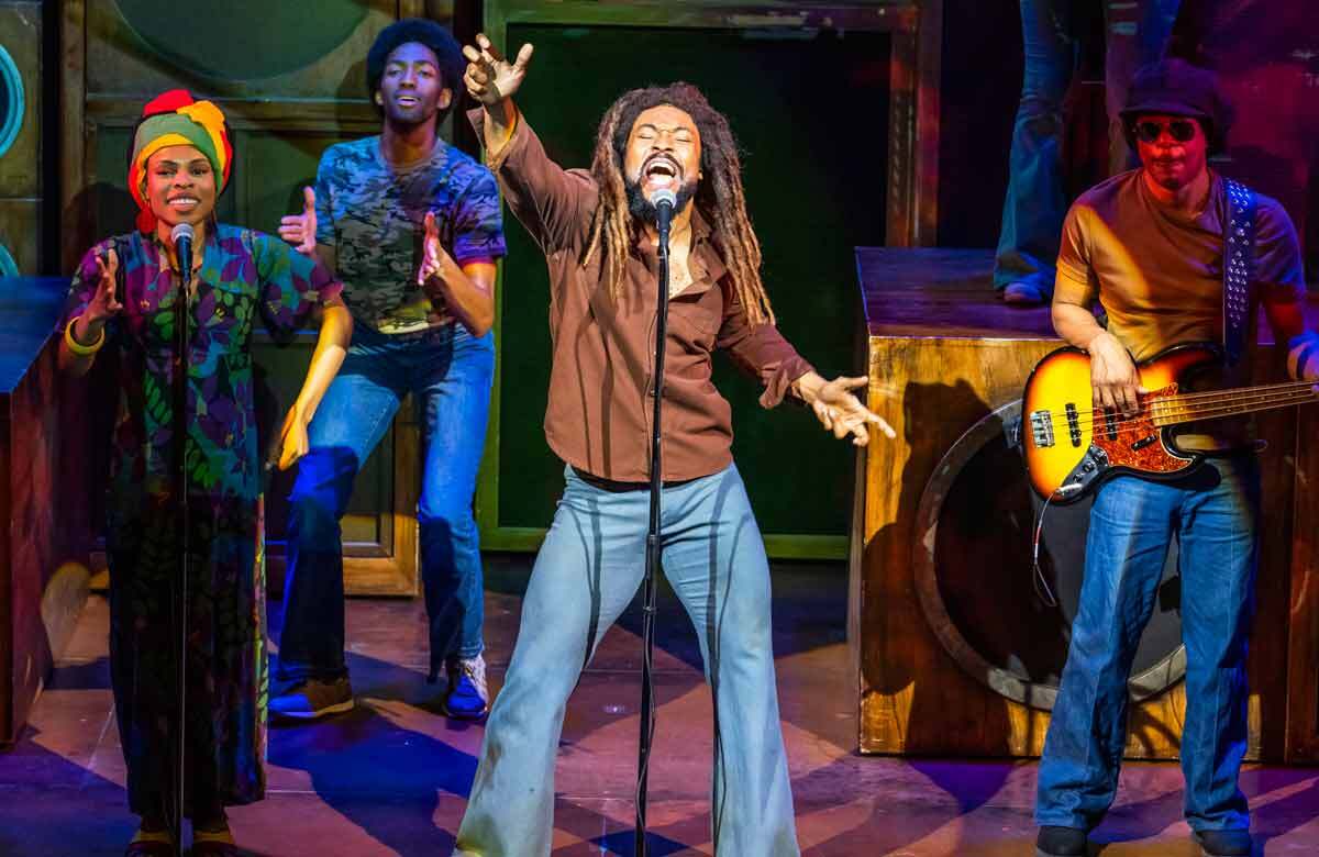 Arinzé Kene (centre) in Get Up, Stand Up! The Bob Marley Musical at the Lyric Theatre. Photo: Tristram Kenton