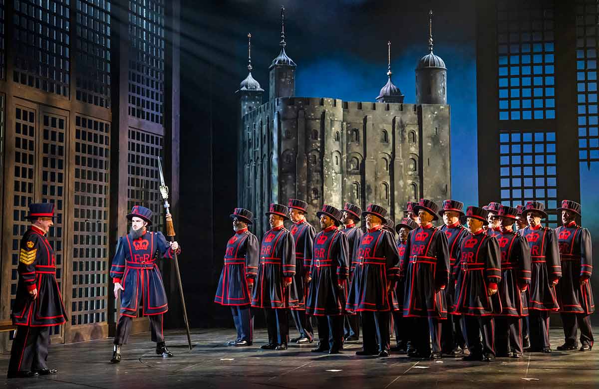 Neal Davies, Anthony Gregory and the cast of The Yeomen of the Guard at London Coliseum. Photo: Tristram Kenton