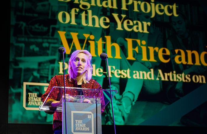 Director Zoe Lafferty picking up The Stage Award for With Fire and Rage, a project telling the stories of artists on the frontline in Ukraine. Photo: David Monteith-Hodge